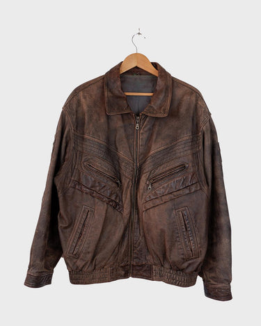Revive the '80s look with this vintage brown used look leather jacket! It's been around the block, but there's still plenty of life in it enough to make a statement that'll stand the test of time. Please keep in mind, that the inner lining of the leather jacket is full of discoloration and cracks that have been sewn up (condition 4/10 for the inner lining). Please have a look at the last 3 photos for the inner lining.