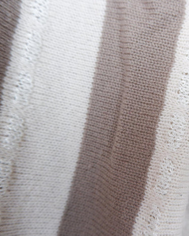 Upgrade your sweater game with this Vintage 80s brown and white striped sweater. Made for both style and comfort, this thin sweater is perfect for any occasion. Don't settle for boring sweaters.