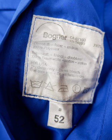 Zip into this Premium Bogner blue hooded jacket (very thin) and make a statement! It's designed with shoulder pads and comes with a hidden hood, so you can always make a quick and effortless transition.