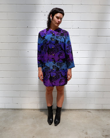 Vintage 80s, floral and fearless. Wear it open as a coat or buttoned up as a dress – either way, it’s a look. Statement gold buttons, bold print, and zero effort. For those who don’t just wear vintage – they own it.