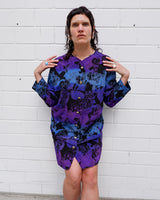 Vintage 80s, floral and fearless. Wear it open as a coat or buttoned up as a dress – either way, it’s a look. Statement gold buttons, bold print, and zero effort. For those who don’t just wear vintage – they own it.