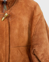 Cuddle up in this vintage '80s brown shearling coat with signature shoulder pads (removable shoulder pads)! With its cozy shearling material, you'll feel like you're getting a hug, all the time! Oh did you already see the special buttons?