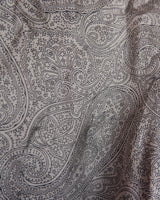 Fine beadwork and soft sequins give this 90s brown-grey waistcoat its understated shine – subtle, but impossible to miss. With a paisley satin back and belt, it’s a thoughtful piece for those who appreciate timeless style and fine detail.