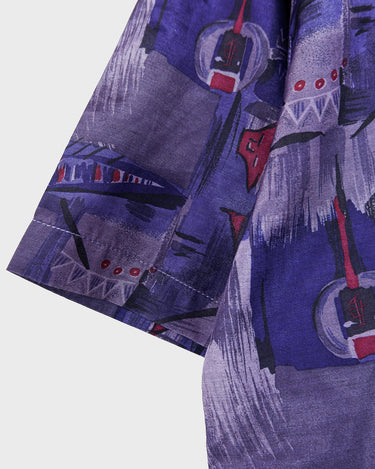 Bold, breezy, and silky smooth - this rare 90s short-sleeve gem by T. Corner is made from real Thai silk, brought to you by one of Thailand’s most renowned silk producers. The glossy fabric pops with a crazy pattern in electric purples and blues that’s impossible to ignore. Wear it loud, wear it proud!