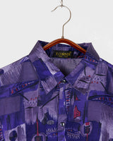 Bold, breezy, and silky smooth - this rare 90s short-sleeve gem by T. Corner is made from real Thai silk, brought to you by one of Thailand’s most renowned silk producers. The glossy fabric pops with a crazy pattern in electric purples and blues that’s impossible to ignore. Wear it loud, wear it proud!