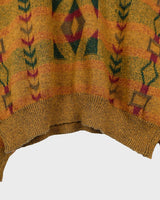 This vintage sweater has fall vibes written all over it, thanks to its alpaca and lambs wool mix in a cozy brown, mustard-yellow combo!