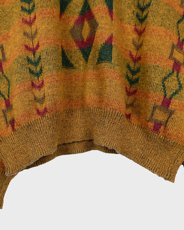 This vintage sweater has fall vibes written all over it, thanks to its alpaca and lambs wool mix in a cozy brown, mustard-yellow combo!