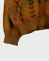 This vintage sweater has fall vibes written all over it, thanks to its alpaca and lambs wool mix in a cozy brown, mustard-yellow combo!
