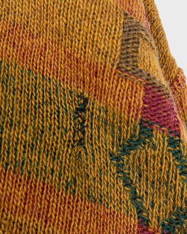 This vintage sweater has fall vibes written all over it, thanks to its alpaca and lambs wool mix in a cozy brown, mustard-yellow combo!