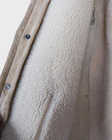 This jacket is an absolute classic! Stay warm in this vintage 80s brown and beige leather winter jacket. Perfect for any size between M - small L, you'll surely slay the day!