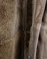 Dip into the vintage look with this super-cozy shearling coat! This classic brown beauty is made for keeping you warm on the chilliest of days. Now you can look as warm as you feel!