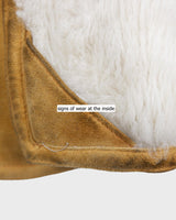 Cozy up in this vintage 80s shearling coat, perfect for chilly days. Its rich brown and mustard yellow colors add a bold touch, while the shearling material provides warmth and comfort. A must-have piece for your wardrobe, this coat is a timeless addition that will never go out of style.