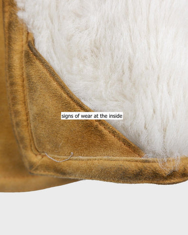 Cozy up in this vintage 80s shearling coat, perfect for chilly days. Its rich brown and mustard yellow colors add a bold touch, while the shearling material provides warmth and comfort. A must-have piece for your wardrobe, this coat is a timeless addition that will never go out of style.