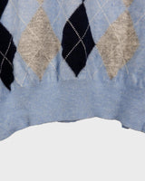 This classic 90s cashmere, merino wool, viscose mix v-neck sweater (thin) brings cozy vibes with effortless style. Make a statement with its timeless argyle pattern – perfect for chilly months! Get snug!