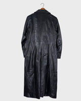 This vintage 90s black long leather belted (optional belt!) coat is your ticket to a timeless look!