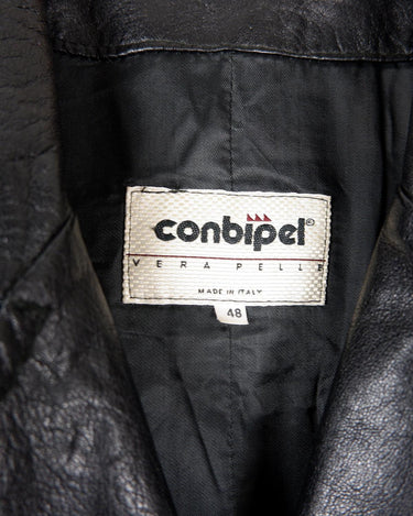 This vintage 90s black long leather belted (optional belt!) coat is your ticket to a timeless look!