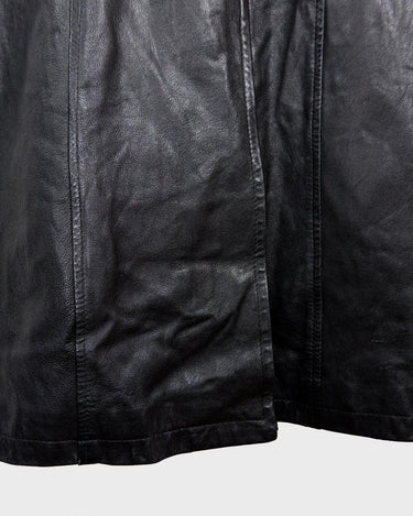 This vintage 90s black long leather belted (optional belt!) coat is your ticket to a timeless look!