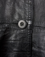 This vintage 90s black long leather belted (optional belt!) coat is your ticket to a timeless look!