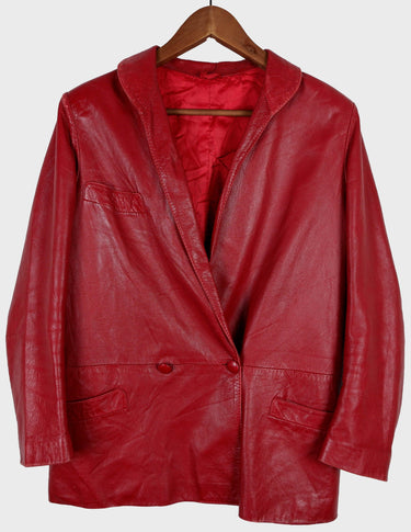 This vintage red leather jacket from the 80s is anything but outdated. With light shoulder pads to add structure, it's the statement piece!