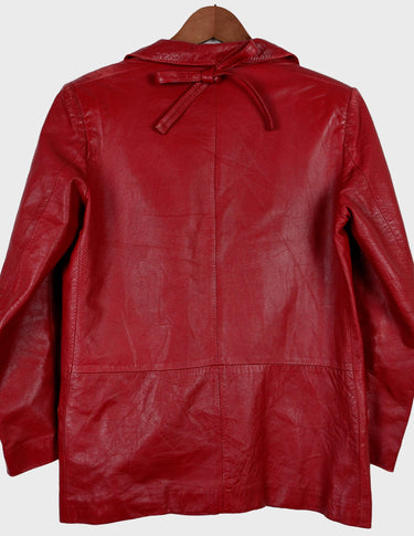 Be bold and rebellious with this Premium red 80s leather jacket. Its intense color and light shoulder pads will turn heads and make a fashion statement wherever you go. Add some attitude and style to your wardrobe today! Please keep in mind that this jacket has more stains and flaws around the shoulder area - last photos.