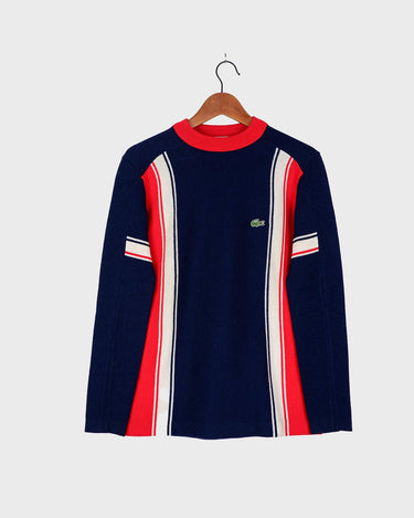 Look snazzy in this navy blue and red color mix Lacoste sweater! This longer fit (length: 66cm) is perfect for keeping you warm and looking snazzy.
