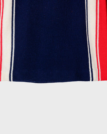 Look snazzy in this navy blue and red color mix Lacoste sweater! This longer fit (length: 66cm) is perfect for keeping you warm and looking snazzy.