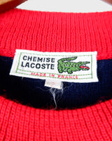 Look snazzy in this navy blue and red color mix Lacoste sweater! This longer fit (length: 66cm) is perfect for keeping you warm and looking snazzy.