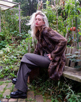 Introducing our Premium Vintage 70s brown real fur jacket, perfect for adding a touch of luxury to any outfit. Made from real fur, this jacket exudes a timeless elegance!