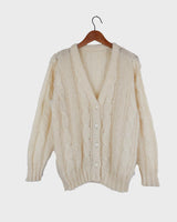 Slip into this cozy Premium Vintage 90s mohair superkid mix cable knit cardigan! Soft, furry and light transparent with a unique twist on a classic style, this cardigan is a must-have for any cable knit lovers!