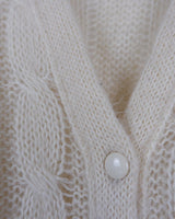 Slip into this cozy Premium Vintage 90s mohair superkid mix cable knit cardigan! Soft, furry and light transparent with a unique twist on a classic style, this cardigan is a must-have for any cable knit lovers!