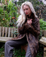 Introducing our Premium Vintage 70s brown real fur jacket, perfect for adding a touch of luxury to any outfit. Made from real fur, this jacket exudes a timeless elegance!