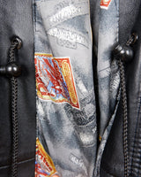 Upgrade your wardrobe with this vintage 80s black nappa leather coat! It features a colorful lining for a pop of color and shoulder pads for a bold look. Timeless and stylish, what's better than that?