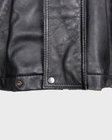 Upgrade your wardrobe with this vintage 80s black nappa leather coat! It features a colorful lining for a pop of color and shoulder pads for a bold look. Timeless and stylish, what's better than that?