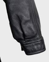 Upgrade your wardrobe with this vintage 80s black nappa leather coat! It features a colorful lining for a pop of color and shoulder pads for a bold look. Timeless and stylish, what's better than that?