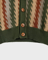 This vintage, 70s-inspired vest (thin) is a classic look you'll love! The earthy green and brown tones create an effortlessly cool look. Button up and feel the 70s vibes!