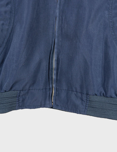 Channel your inner '90s cool kid in this stylish blue bomber jacket! Featuring a stitched logo and classic design, it'll give you the amazing look you crave!