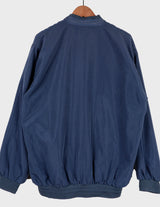 Channel your inner '90s cool kid in this stylish blue bomber jacket! Featuring a stitched logo and classic design, it'll give you the amazing look you crave!