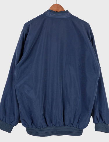 Channel your inner '90s cool kid in this stylish blue bomber jacket! Featuring a stitched logo and classic design, it'll give you the amazing look you crave!
