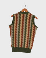 This vintage, 70s-inspired vest (thin) is a classic look you'll love! The earthy green and brown tones create an effortlessly cool look. Button up and feel the 70s vibes!