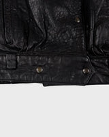 This Vintage 80s black leather jacket is the ultimate classic, complete with press buttons, structured vibes, and smooth leather.