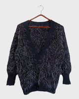Add some retro sparkle to your wardrobe with this vintage 80s black glitter v-neck sweater. Who needs subtle when you can shine?!