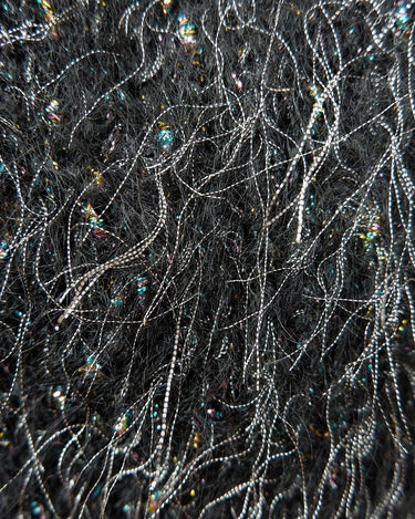 Add some retro sparkle to your wardrobe with this vintage 80s black glitter v-neck sweater. Who needs subtle when you can shine?!