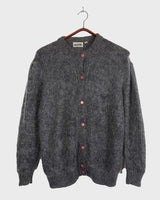 Get your hands on this amazing Vintage 80s grey mohair mix cardigan! It comes with fun pink buttons that add a touch of playfulness to your outfit. Perfect for layering and adding a pop of color to your look.