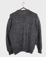 Get your hands on this amazing Vintage 80s grey mohair mix cardigan! It comes with fun pink buttons that add a touch of playfulness to your outfit. Perfect for layering and adding a pop of color to your look.