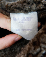 This Vintage 80s 90s brown sheapskin coat is like a warm hug! "Get ready to feel like you're wrapped in a cozy embrace with this Vintage 80s 90s brown sheapskin coat! Say goodbye to feeling chilly and hello to snug style."