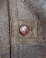 This Vintage 80s 90s brown sheapskin coat is like a warm hug! "Get ready to feel like you're wrapped in a cozy embrace with this Vintage 80s 90s brown sheapskin coat! Say goodbye to feeling chilly and hello to snug style."