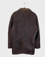 This Vintage 80s 90s brown sheapskin coat is like a warm hug! "Get ready to feel like you're wrapped in a cozy embrace with this Vintage 80s 90s brown sheapskin coat! Say goodbye to feeling chilly and hello to snug style."