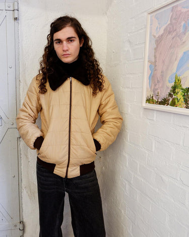 This '70s Vintage jacket is a reversible stunner, featuring a beige / brown flipside and a cozy faux fur collar. Throw it on for confidence look twice as nice - with half the effort!