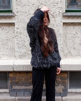 Add some retro sparkle to your wardrobe with this vintage 80s black glitter v-neck sweater. Who needs subtle when you can shine?!