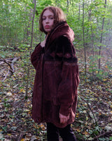 Get ready to slay in this vintage 80s hood coat! Made from brown-red leather and fake fur applications this coat is perfect for keeping you warm on those chilly days. 